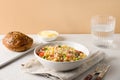 Salad with ditalini pasta, peas, vegan sausage on modern white table. Close up Royalty Free Stock Photo