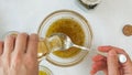 Salad dressing ingredients, as olive oil, honey, lemon juice, seasoning, mustard and black pepper.