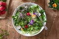 Salad with edible pansies and fresh broccoli and kale microgreens