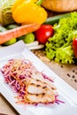 Salad with eel, carrot, red onion, sesame seeds Royalty Free Stock Photo
