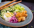 Salad from eggs, fried fish and fresh vegetables Royalty Free Stock Photo