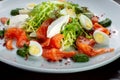 Salad from eggs, greens and trout.
