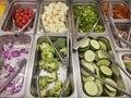 Salad and food bar with stainless steel pans and tongs Royalty Free Stock Photo