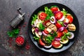 Salad with fresh and grilled vegetables and mushrooms. Vegetable salad with grilled champignons. Vegetable salad on plate Royalty Free Stock Photo