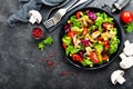 Salad with fresh and grilled vegetables and mushrooms. Vegetable salad with grilled champignons. Vegetable salad on plate Royalty Free Stock Photo