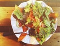 Salad. Fresh summer lettuce salad.Healthy mediterranean salad on wooden table. Vegetarian food Royalty Free Stock Photo