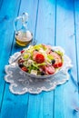 Salad. Fresh summer lettuce salad.Healthy mediterranean salad olives tomatoes parmesan cheese and prosciutto Royalty Free Stock Photo