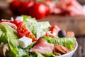 Salad. Fresh summer lettuce salad.Healthy mediterranean salad olives tomatoes parmesan cheese and prosciutto Royalty Free Stock Photo