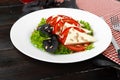 Salad with fresh tomatoes and brined cheese, sunflower seeds on top