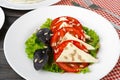 Salad with fresh tomatoes and brined cheese, sunflower seeds on top