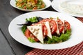 Salad with fresh tomatoes and brined cheese, sunflower seeds on top