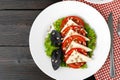 Salad with fresh tomatoes and brined cheese, sunflower seeds on top