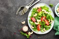 Salad with fresh vegetables and nuts. Vegetable salad with fresh vegetables and cashew. Vegetable salad on plate Royalty Free Stock Photo