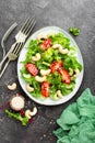 Salad with fresh vegetables and nuts. Vegetable salad with fresh vegetables and cashew. Vegetable salad on plate Royalty Free Stock Photo