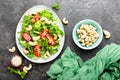 Salad with fresh vegetables and nuts. Vegetable salad with fresh vegetables and cashew. Vegetable salad on plate Royalty Free Stock Photo