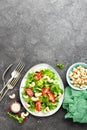 Salad with fresh vegetables and nuts. Vegetable salad with fresh vegetables and cashew. Vegetable salad on plate Royalty Free Stock Photo