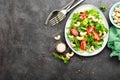 Salad with fresh vegetables and nuts. Vegetable salad with fresh vegetables and cashew. Vegetable salad on plate Royalty Free Stock Photo