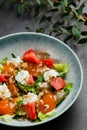 Salad with fresh vegetables and peach closeup. Fresh Summer Salad with Peaches and Buratta Cheese Royalty Free Stock Photo