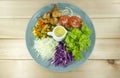 Salad fried shrimp fresh vegetables in a blue plate Royalty Free Stock Photo