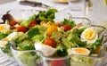 Salad glass bowl with spinach, boiled eggs, cherry tomatoes