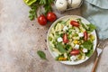 Salad with gluten free pasta, spinach, tomatoes, beans and feta cheese on a stone table. Italian food. Healthy food, vegetarian Royalty Free Stock Photo