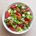 Salad with grapefruit, white cheese, pomegranate and nuts. Healthy eating. Vegetarian food. Diet