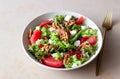 Salad with grapefruit, white cheese, pomegranate and nuts. Healthy eating. Vegetarian food. Diet