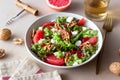 Salad with grapefruit, white cheese, pomegranate and nuts. Healthy eating. Vegetarian food. Diet