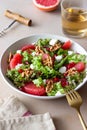 Salad with grapefruit, white cheese, pomegranate and nuts. Healthy eating. Vegetarian food. Diet