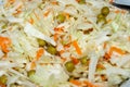 Salad, grated carrots, green peas and fresh cabbage close up Royalty Free Stock Photo