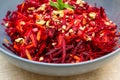 Salad of grated red beets carrots pomegranates and walnuts Royalty Free Stock Photo