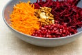 Salad of grated red beets carrots pomegranates and walnuts Royalty Free Stock Photo