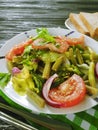 Salad green beans, tomato,delicious on a wooden gourmet background, bread red pepper appetizing Royalty Free Stock Photo