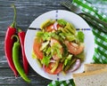 Salad green beans, tomato, dining a wooden gourmet lettuce , bread red pepper appetizing lunch Royalty Free Stock Photo