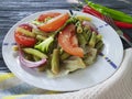 Salad green beans, tomato, organic a wooden gourmet lettuce , bread pepper appetizing lunch spices