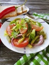 Salad green beans, tomato,nutrition on a wooden gourmet background, bread red pepper appetizing Royalty Free Stock Photo