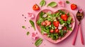 Salad Greens Mix in Heart Shape plate on pink background, Health Concept, Copy Space, Restaurant Valentine\'s day