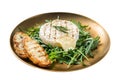 Salad with grilled Camembert cheese, arugula, toast and rosemary in a plate. Isolated on white background. Top view. Royalty Free Stock Photo