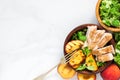 Salad with grilled chicken and peach in a bowl with fork. healthy food. top view Royalty Free Stock Photo