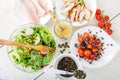 Salad with grilled meat, smoked fish and different vegetables.