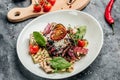 Salad with grilled prime beef or Thick Slices of Marbling Steak with grilled vegetables, nuts, sauce. Fresh Juicy medium Rare Royalty Free Stock Photo