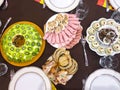 Salad with kiwi, ham, pieces of stuffed turkey, rolls with salmon at a Christmas dinner