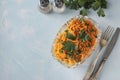 Salad with Korean carrots, ham, eggs, onion and mushrooms in a transparent salad bowl on a light blue background, Top Royalty Free Stock Photo