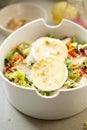 Salad with lettuce, brie, fried pears, camembert, walnuts, red onion, tomatoes and raspberry vinaigrette dressing Royalty Free Stock Photo