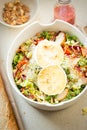 Salad with lettuce, brie, fried pears, camembert, walnuts, red onion, tomatoes and raspberry vinaigrette dressing Royalty Free Stock Photo