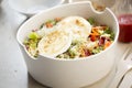 Salad with lettuce, brie, fried pears, camembert, walnuts, red onion, tomatoes and raspberry vinaigrette dressing Royalty Free Stock Photo