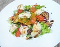 Salad from the liver of codfish, boiled baby potatoes with dried tomatoes and parmesan. Royalty Free Stock Photo