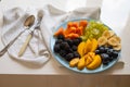 Salad Made From Fresh Summer Fruits On Blue Plate. Royalty Free Stock Photo