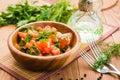 Salad made of tomatoes and fresh herbs, vegetable oil and fork o Royalty Free Stock Photo