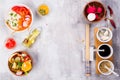 Salad making. Cutlery and dressing ingredients for fresh salad on stone gray background, top view Royalty Free Stock Photo